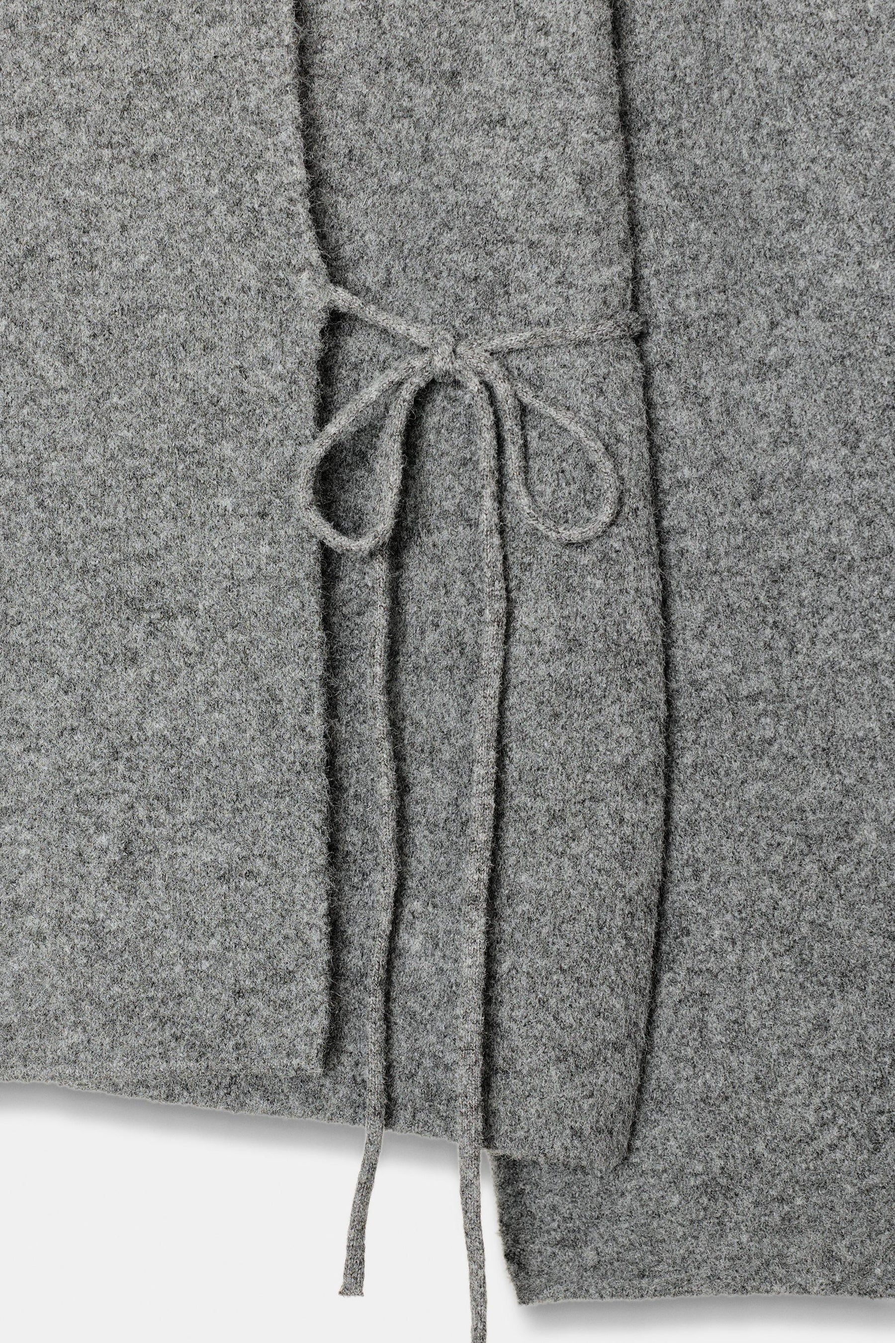 Cardigan mit offenen Ärmeln