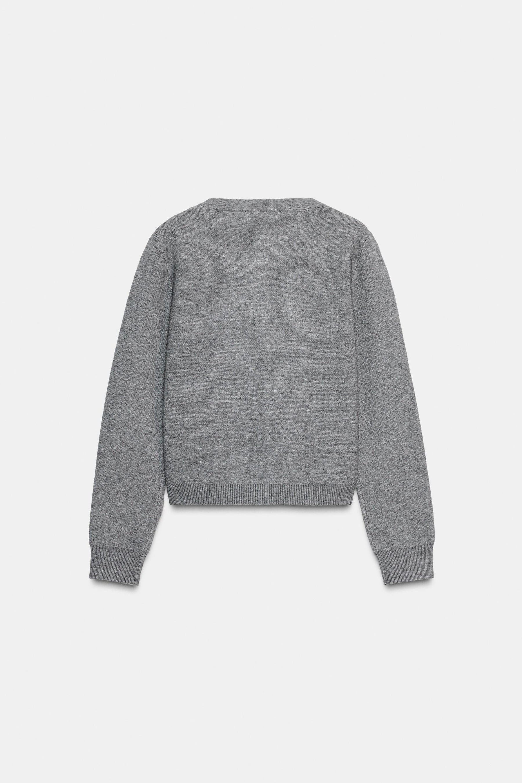 Perlenbesetzte Strickjacke