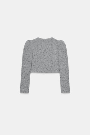 Perlenbesetzte Schaffelljacke