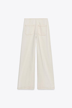 Hochgeschnittene, perlenbesetzte Jeans