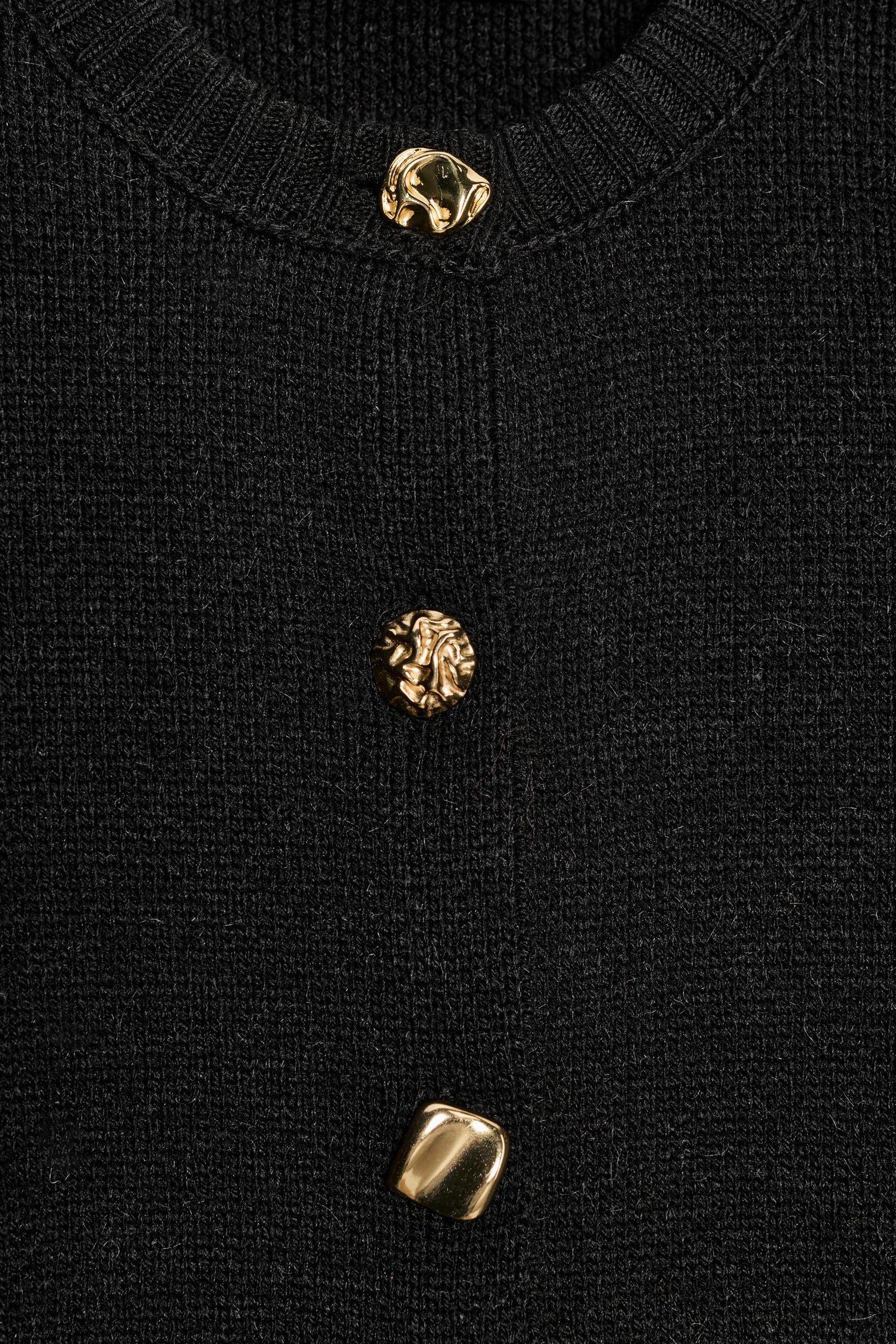 Strickjacke mit Schulter