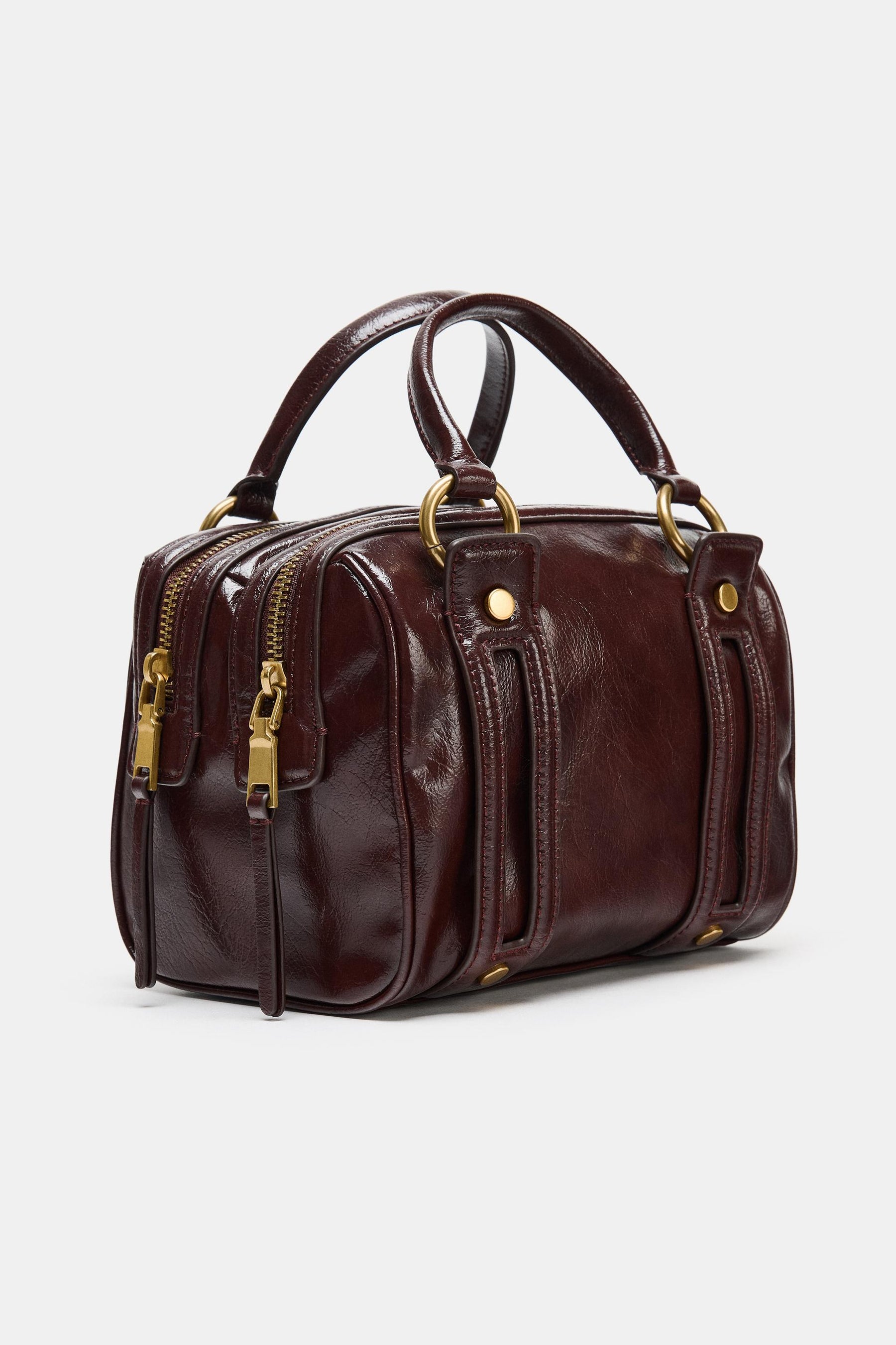 Handtasche mit Metallic-Details